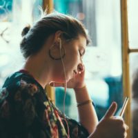 Woman Listening to Podcast